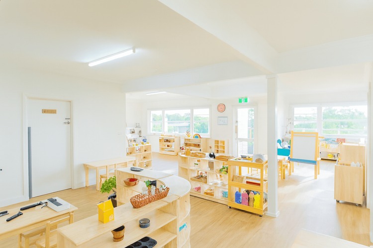 Childcare classroom with learning resources and play areas